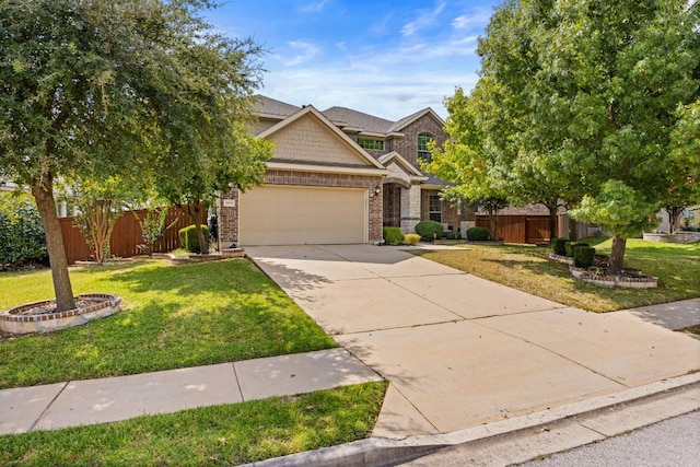 view of front of property featuring a garage and a front yard