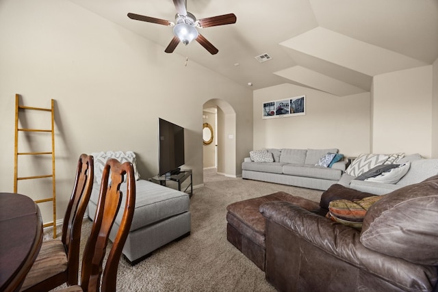 carpeted living room featuring ceiling fan and vaulted ceiling