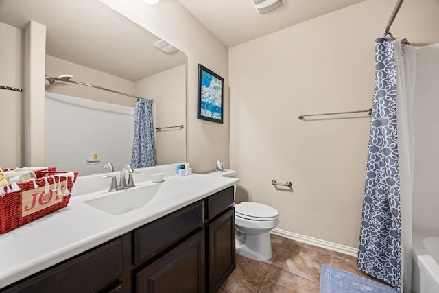 full bathroom with toilet, vanity, tile patterned floors, and shower / tub combo