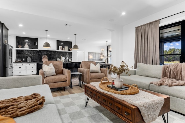 living room with light hardwood / wood-style flooring