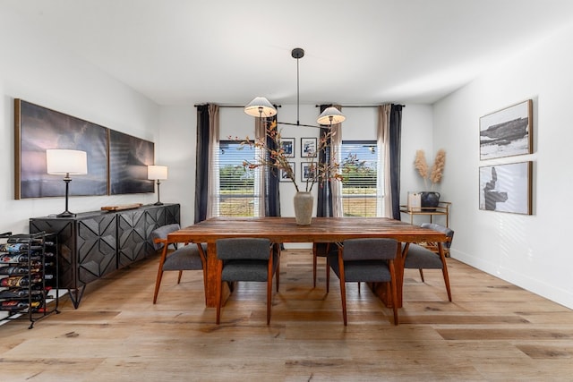 dining space featuring light wood-type flooring