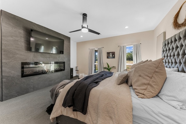 carpeted bedroom with tile walls and ceiling fan