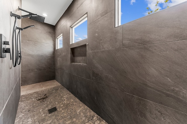 bathroom with tiled shower