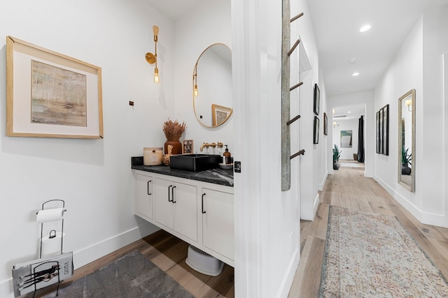 bathroom featuring vanity and hardwood / wood-style flooring