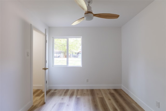 empty room featuring ceiling fan and light hardwood / wood-style flooring