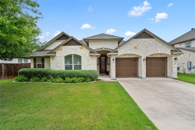 view of front of house featuring a front yard and a garage