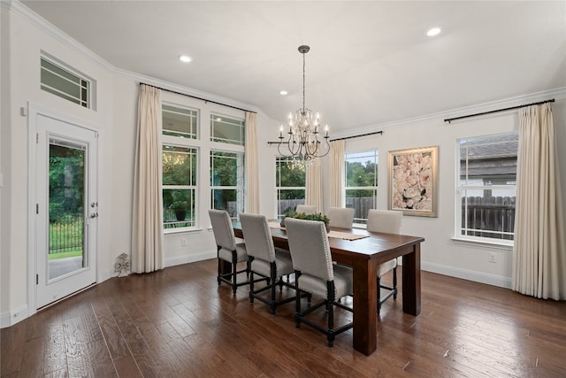 dining room with a notable chandelier, dark hardwood / wood-style floors, and ornamental molding