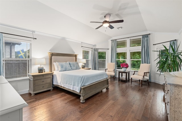 bedroom with lofted ceiling, dark wood-type flooring, and multiple windows