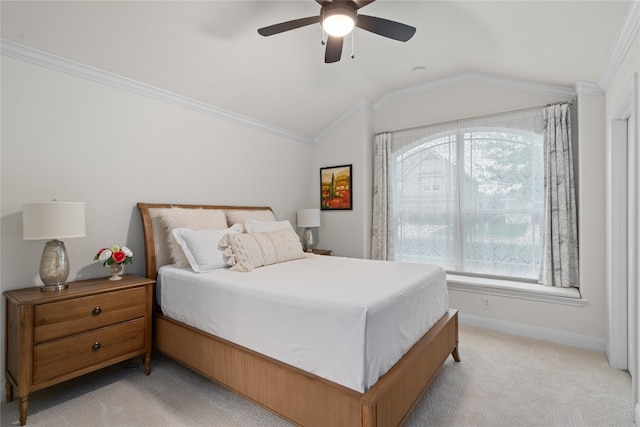 carpeted bedroom with crown molding, vaulted ceiling, and ceiling fan