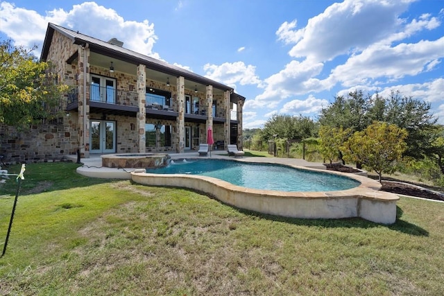 4408 Blacksmith Cv, Spicewood, TX 78669 - view of pool with french doors, a yard, a pool with connected hot tub, and a patio area
