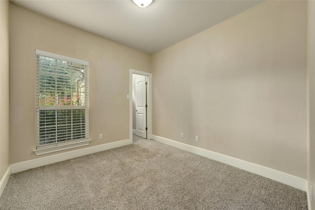 empty room with carpet flooring