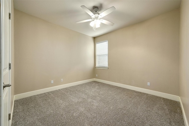 empty room with ceiling fan and carpet floors