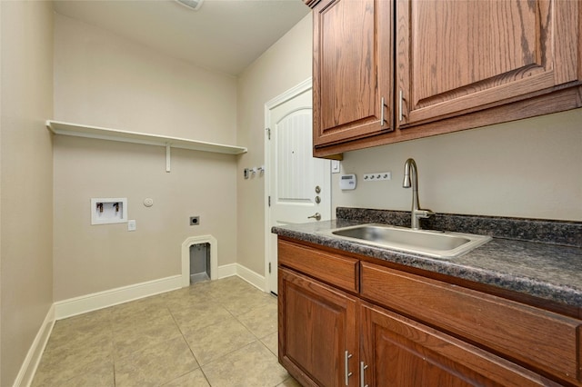 clothes washing area with cabinets, sink, hookup for a washing machine, light tile patterned floors, and hookup for an electric dryer