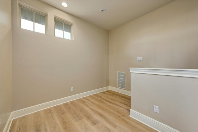 unfurnished room featuring light hardwood / wood-style floors