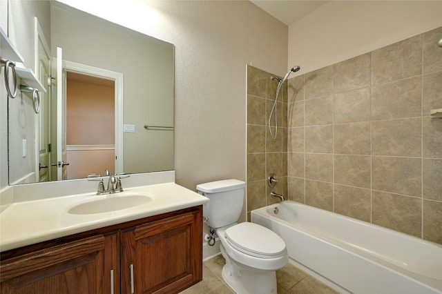 full bathroom featuring tile patterned flooring, tiled shower / bath combo, toilet, and vanity