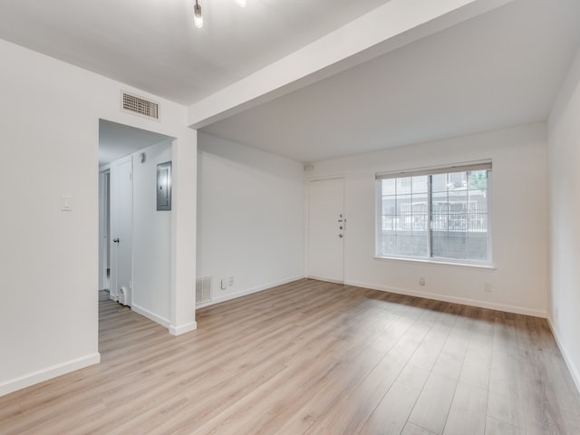 empty room with light hardwood / wood-style floors