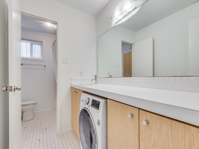 bathroom with washer / clothes dryer, curtained shower, vanity, tile patterned flooring, and toilet