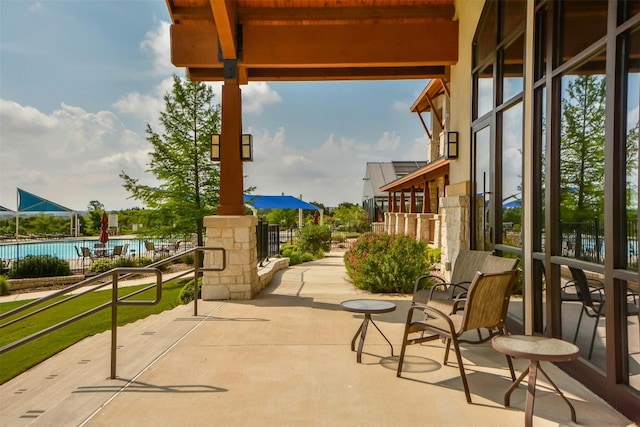 view of patio featuring a community pool