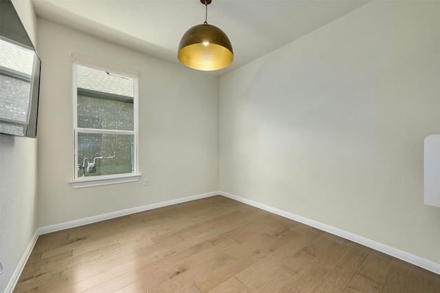 unfurnished room featuring light hardwood / wood-style flooring