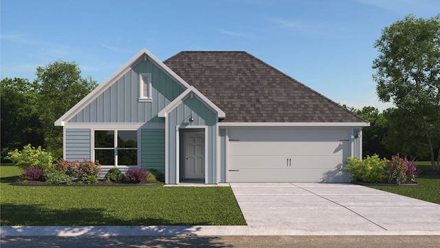 view of front of home featuring a front yard and a garage