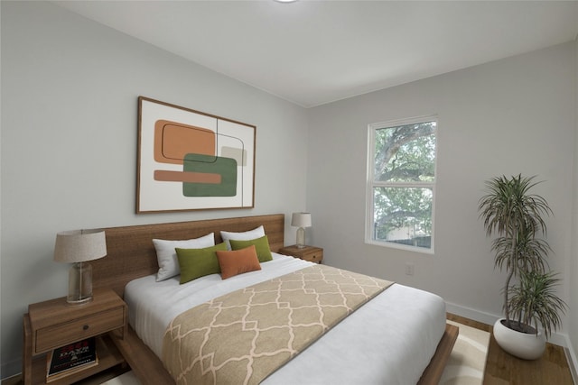 bedroom with wood-type flooring