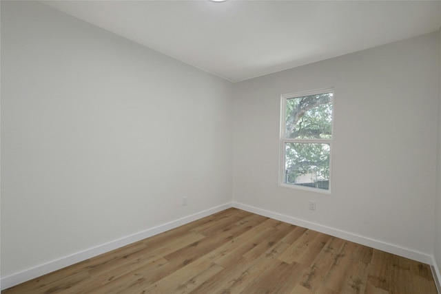 spare room with light wood-type flooring