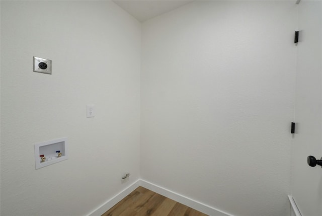 laundry room with wood-type flooring, washer hookup, and electric dryer hookup