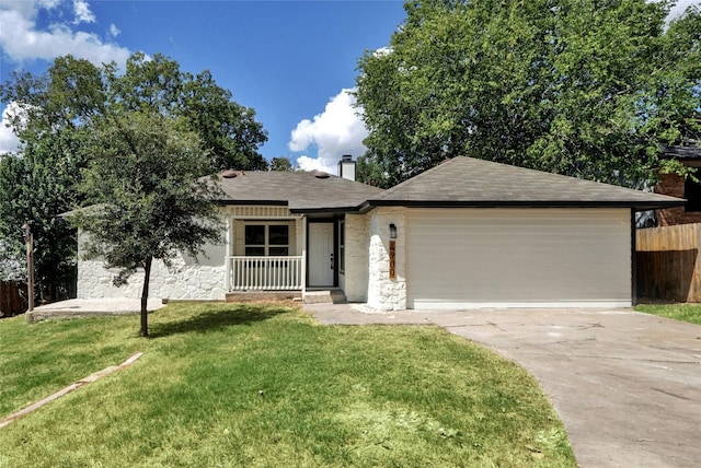 ranch-style home with a garage and a front lawn