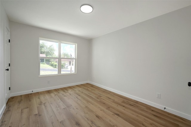 spare room with light hardwood / wood-style flooring