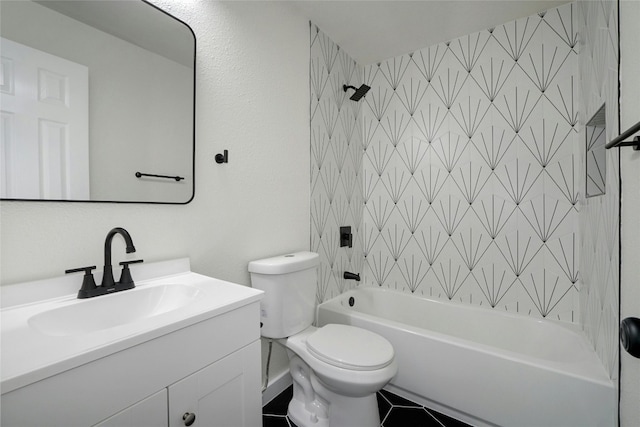 full bathroom featuring vanity, tile patterned flooring, tiled shower / bath, and toilet