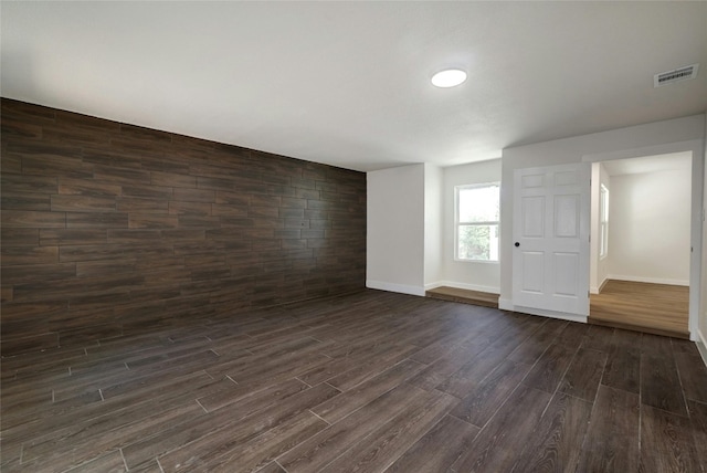 spare room featuring dark hardwood / wood-style flooring