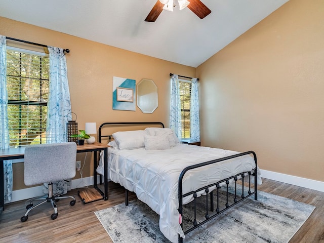 bedroom featuring vaulted ceiling, ceiling fan, and hardwood / wood-style floors