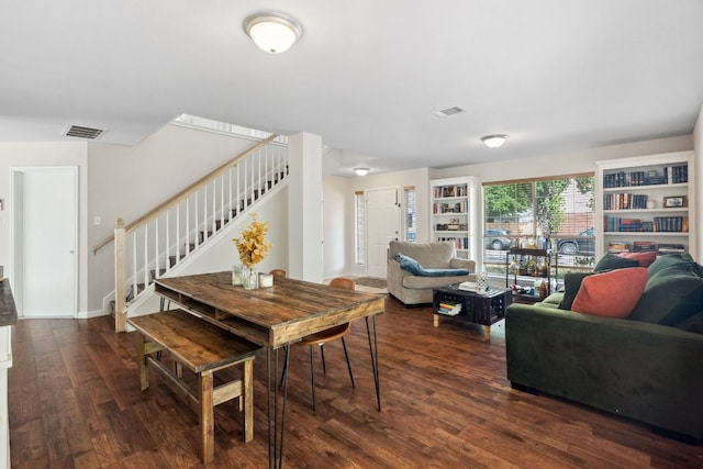 dining area with dark hardwood / wood-style flooring