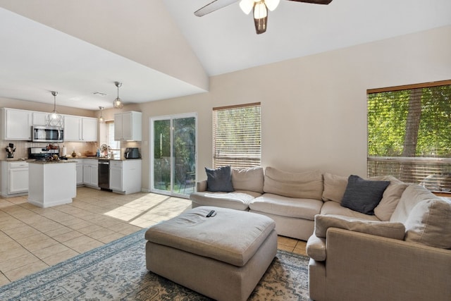 17200 Village Glen Rd, Pflugerville, TX 78660 - living area featuring light tile patterned floors, ceiling fan, and vaulted ceiling