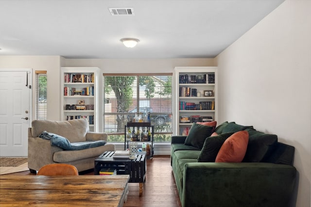 living room featuring dark wood-type flooring