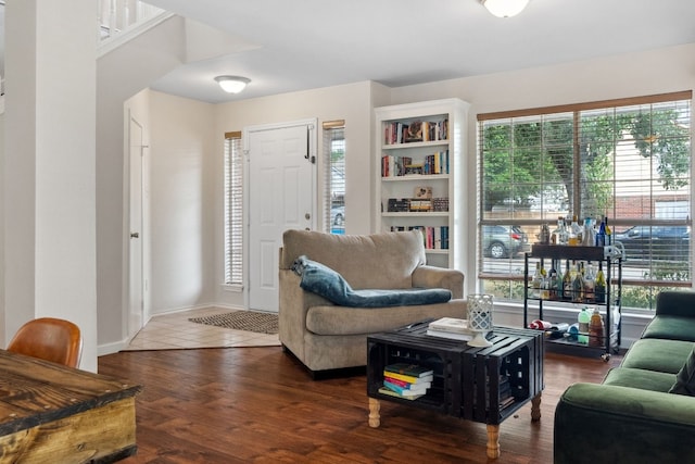 living room with dark hardwood / wood-style flooring