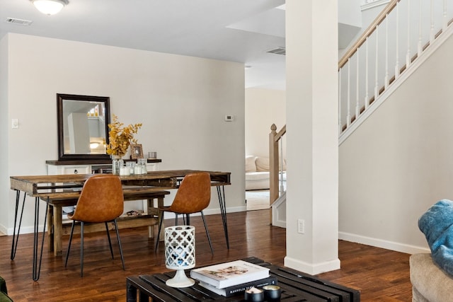 dining area with dark wood-type flooring