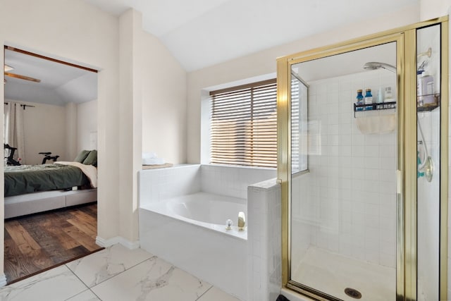 17200 Village Glen Rd, Pflugerville, TX 78660 - ensuite bathroom with vaulted ceiling, marble finish flooring, a stall shower, and a garden tub