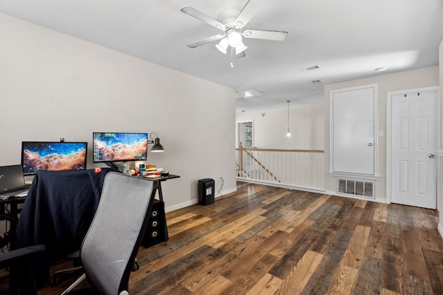 office space with ceiling fan and dark wood-type flooring