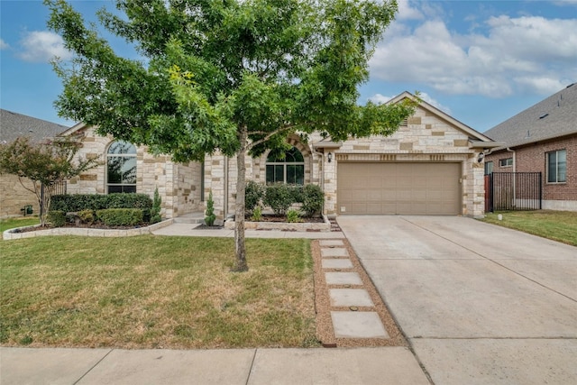 view of front of home with a front lawn and a garage