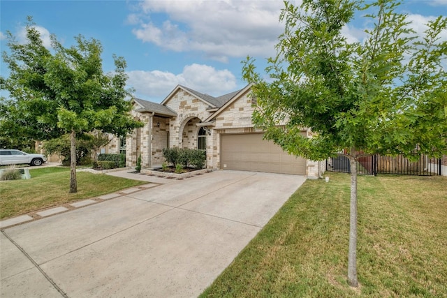 view of front of home with a garage and a front yard