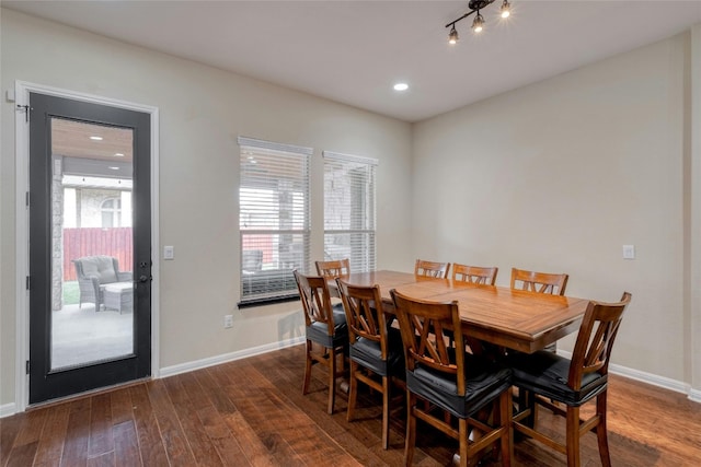 dining space featuring dark hardwood / wood-style flooring