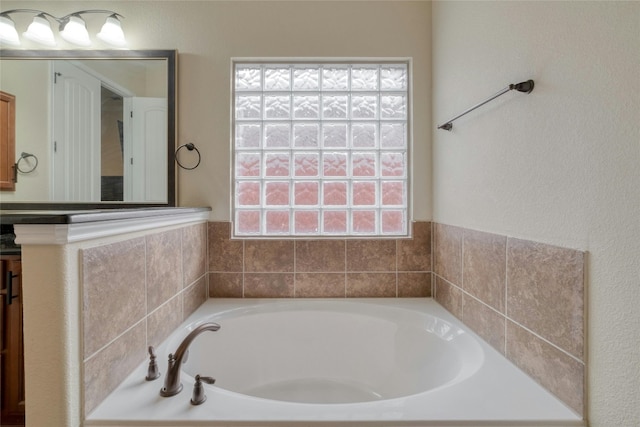 bathroom featuring tiled bath