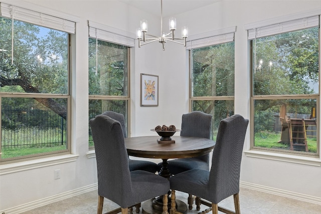 dining space featuring an inviting chandelier and light tile patterned flooring