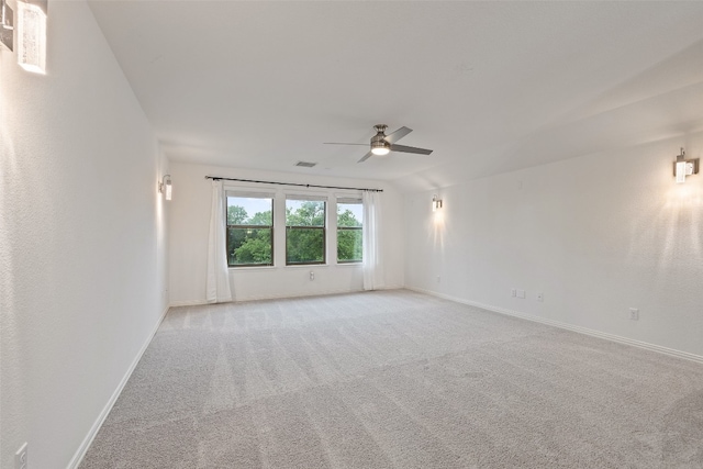 empty room with light carpet and ceiling fan