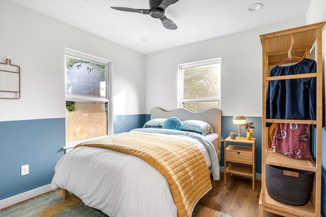 bedroom featuring dark wood-type flooring and ceiling fan