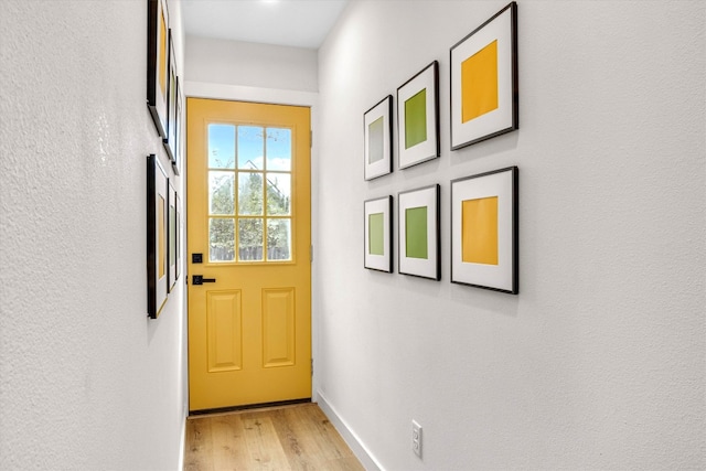 doorway to outside featuring light wood-type flooring