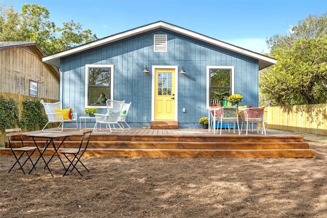 rear view of house with a wooden deck