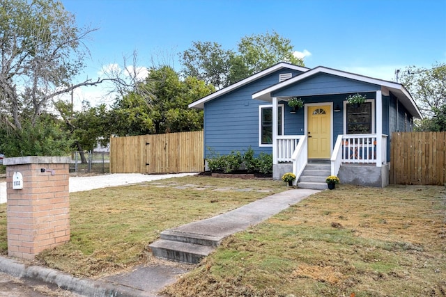 bungalow-style house with a front yard