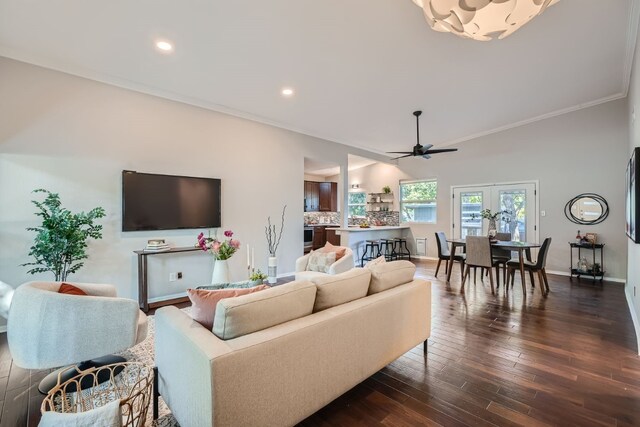 living room with ceiling fan, dark hardwood / wood-style floors, and crown molding